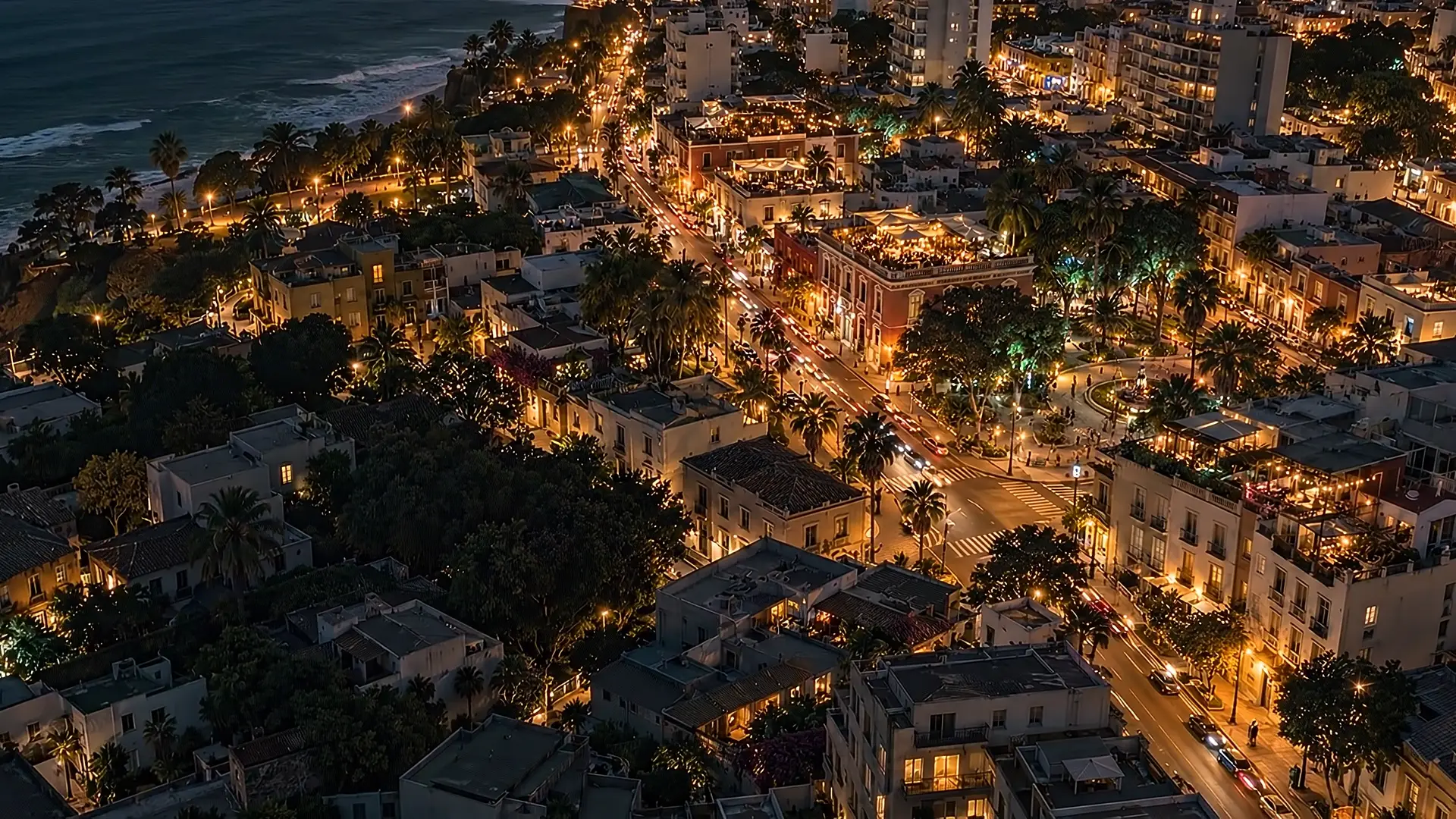 Vista aérea de un barrio costero de noche